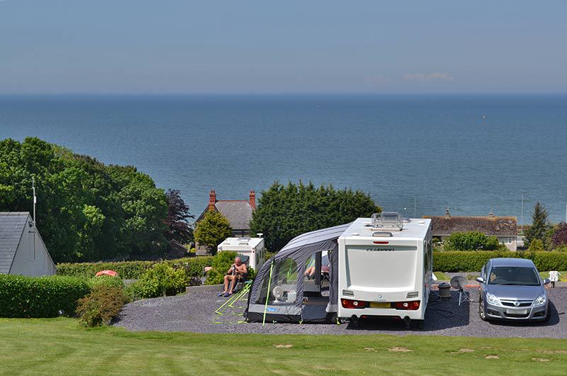 Caravan and awning by the sea