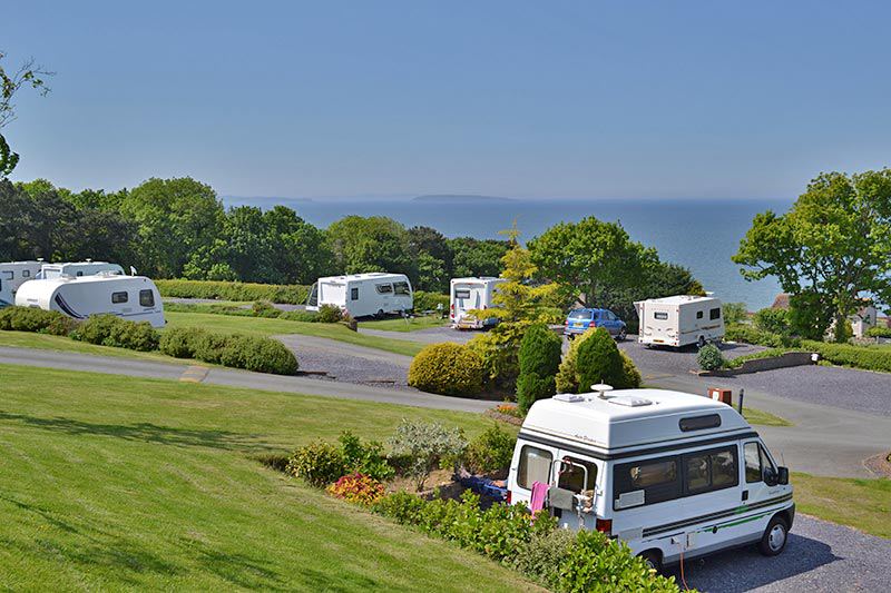 Pitches with sea beyond
