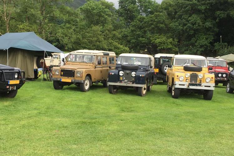 Vehicles and tents on the grass