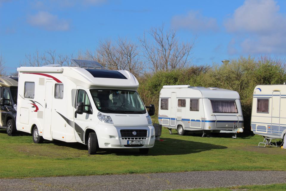 Motorhomes and tourers on grass