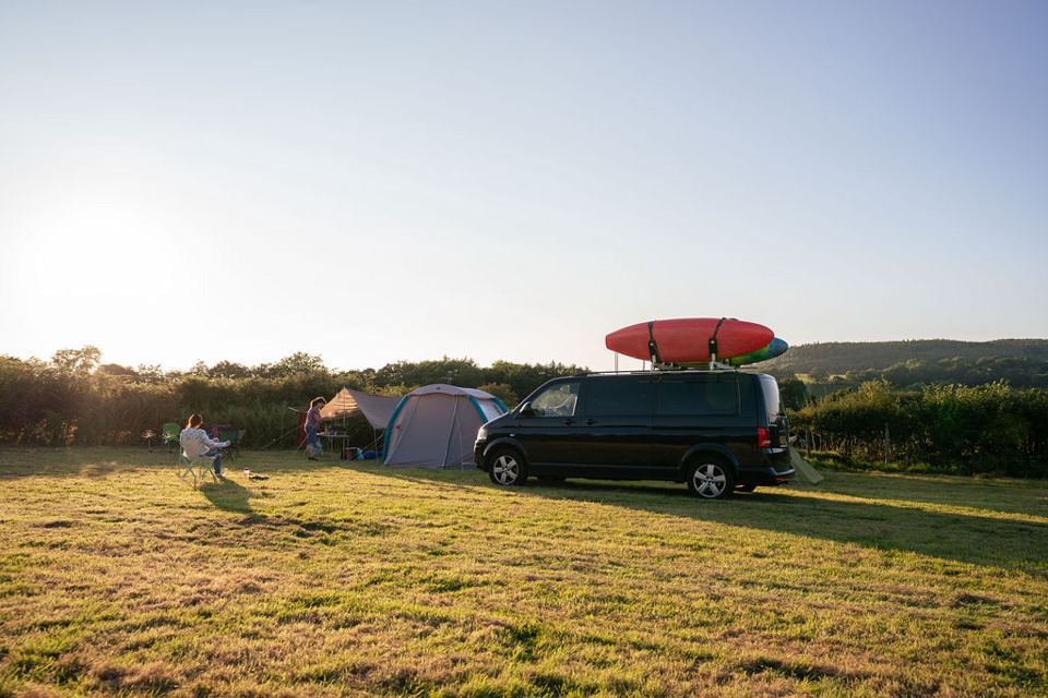 Campervan and tents on the grass