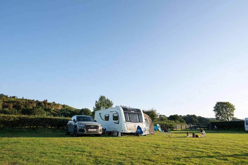 Touring caravan on open grass