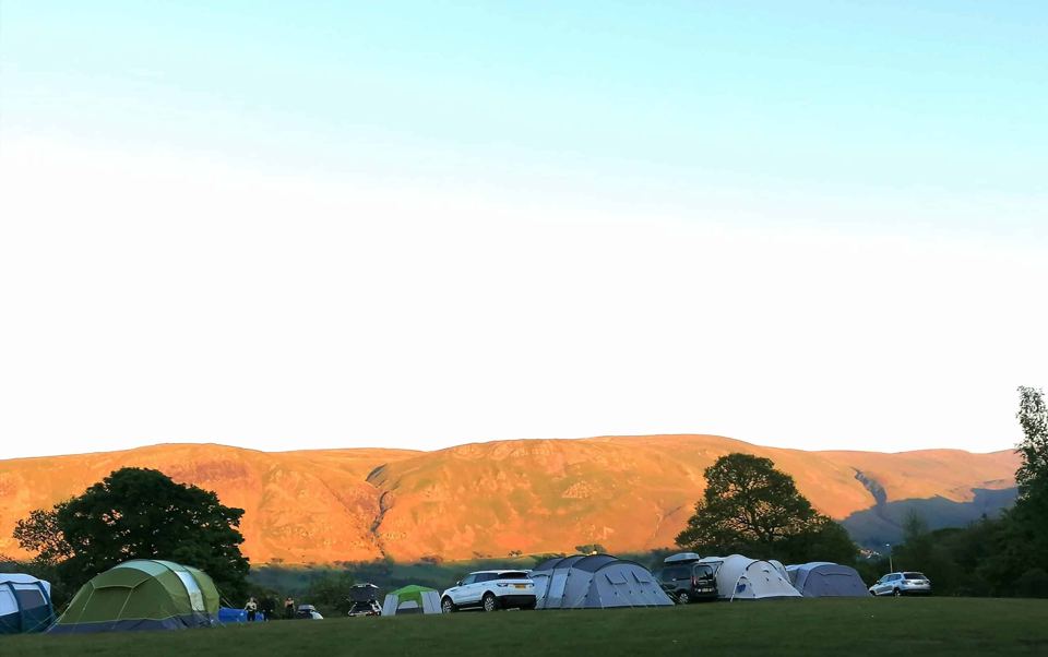 Tents on the field below the fells