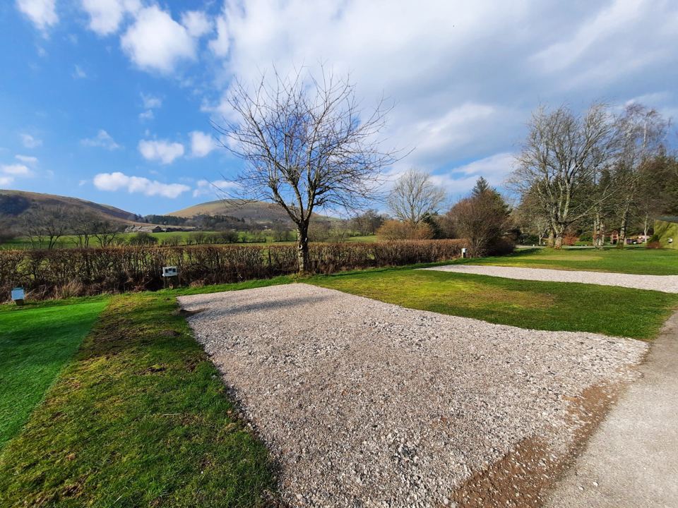 Gravel pitch with view of the hills