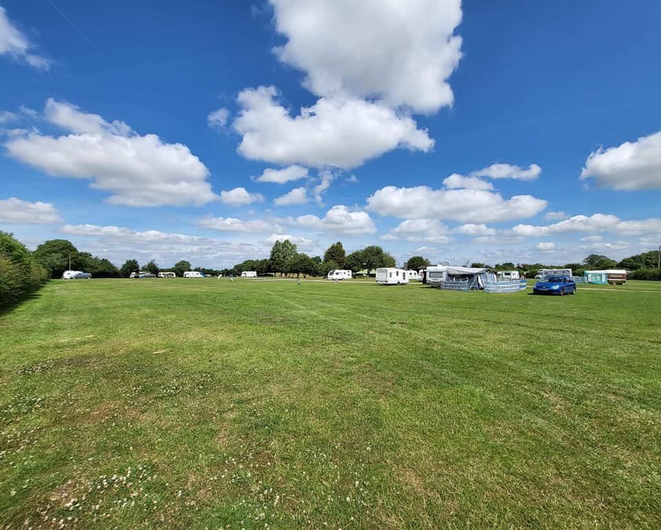 Grass field with tourers