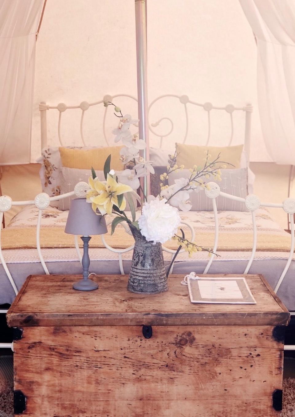 Bed inside a bell tent