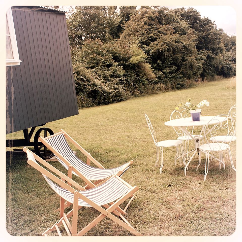 Shepherd's hut and garden chairs