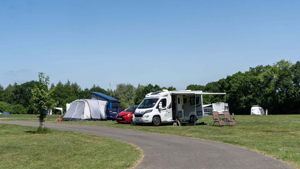 Grass pitches beside the access road