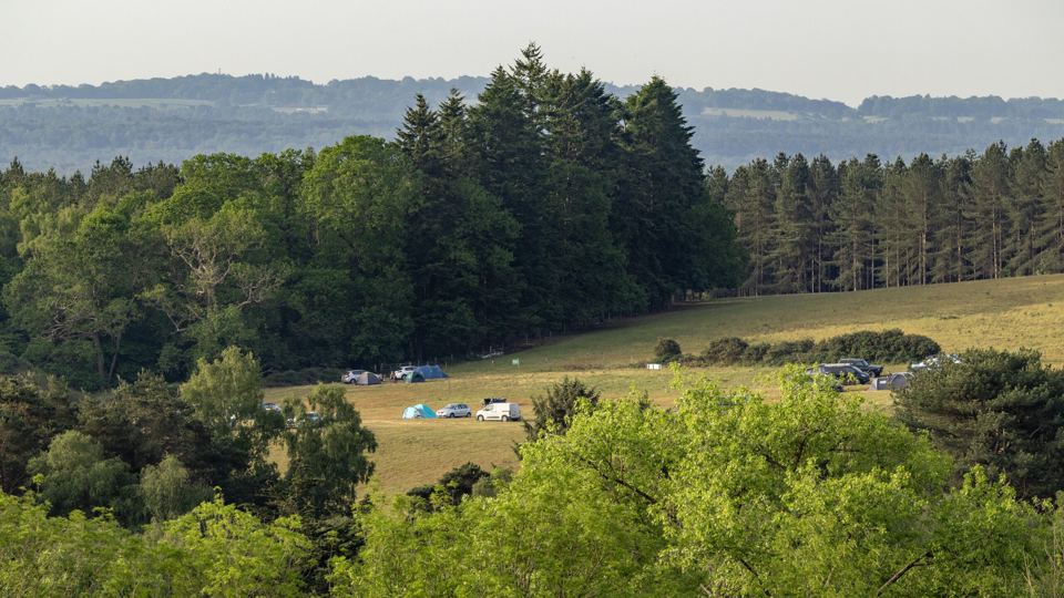 Camping field and wooded hills