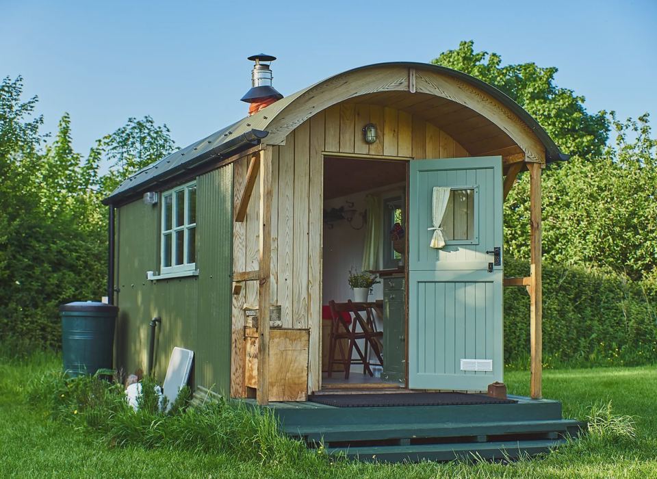 Green shepherd's hut with chimney