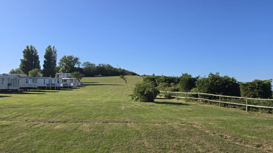 Grass field and caravans