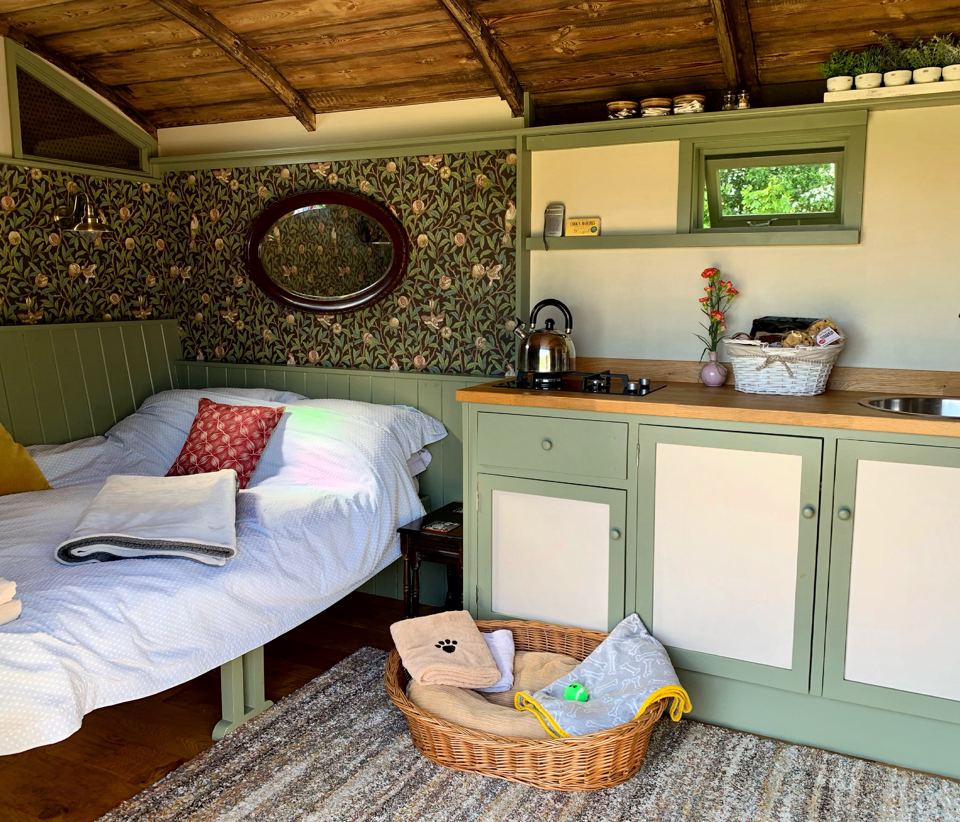 Bed and kitchenette in a hut