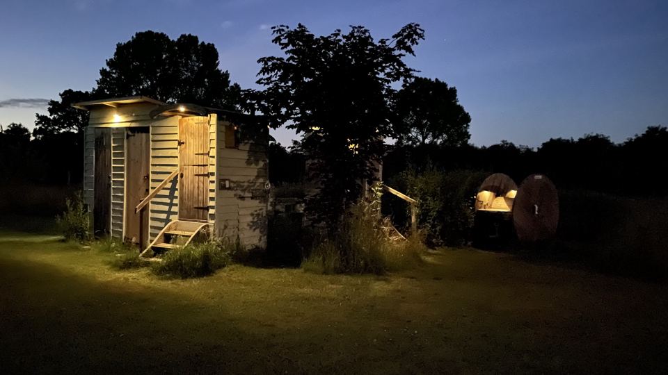 Composting toilet at dusk