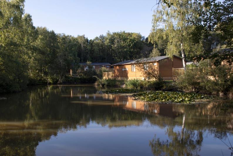Lake with lodges beyond