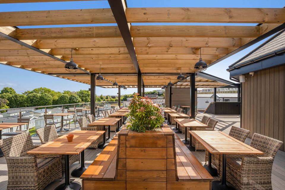 Outdoor terrace with long tables
