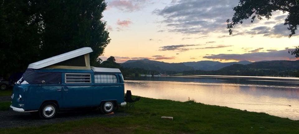 Campervan by the lake at sunset