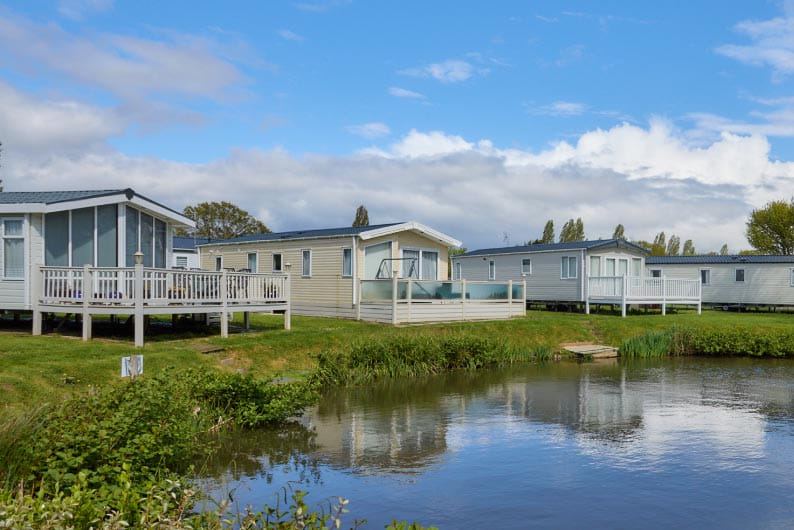 Caravans beside a pond