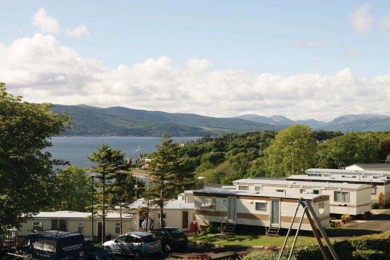 Caravans with hill and water views