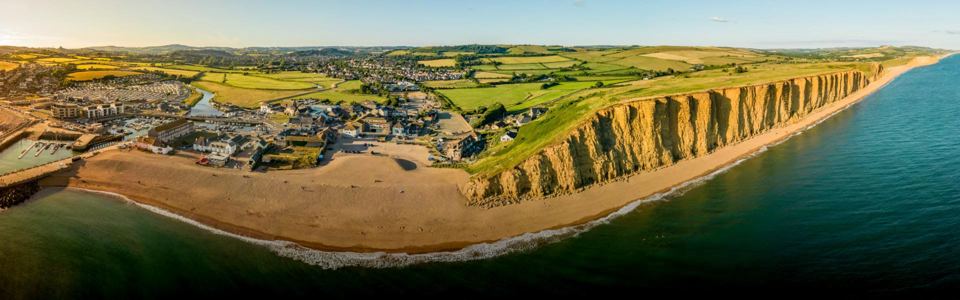 Aerial view of West Bay and cliffs