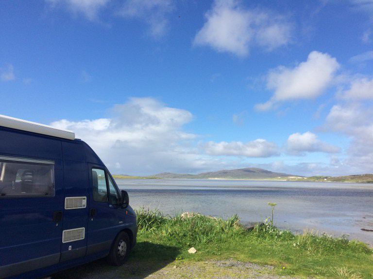 Van parked above the sands