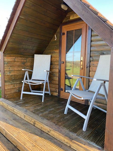 Cabin with decking and chairs