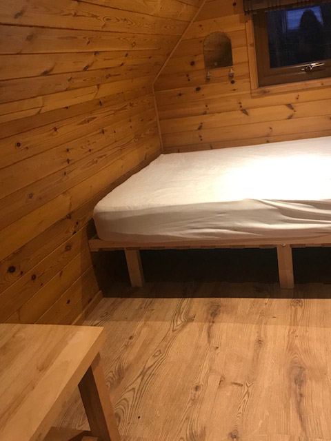 Pod bedroom with timber walls