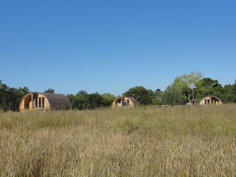 Three cabins across the meadow