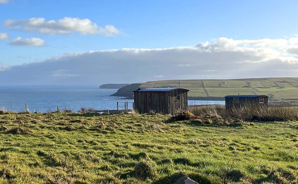 Shepherd's huts by the sea