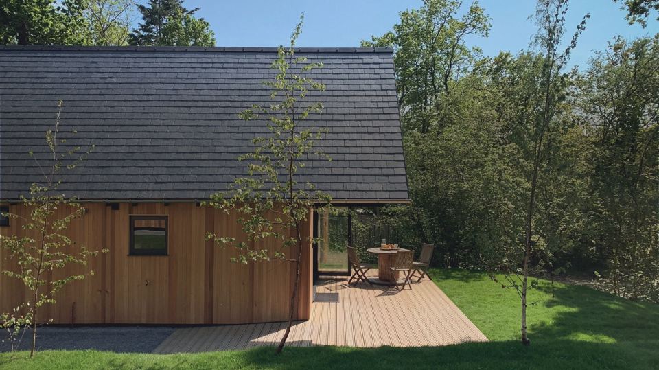 Lodge with decking and lawn