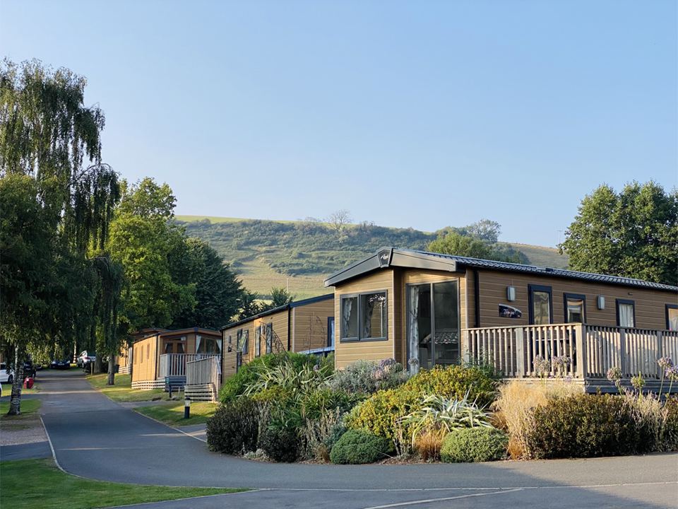 Lodges along the road with hills