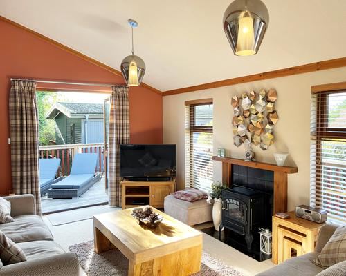 Lodge living room with log burner