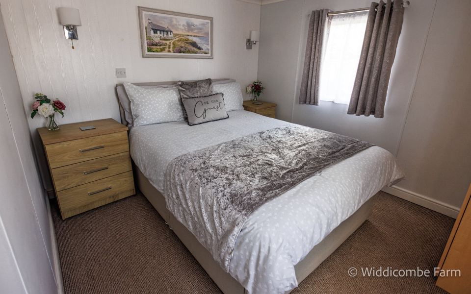 Double bedroom with grey throw