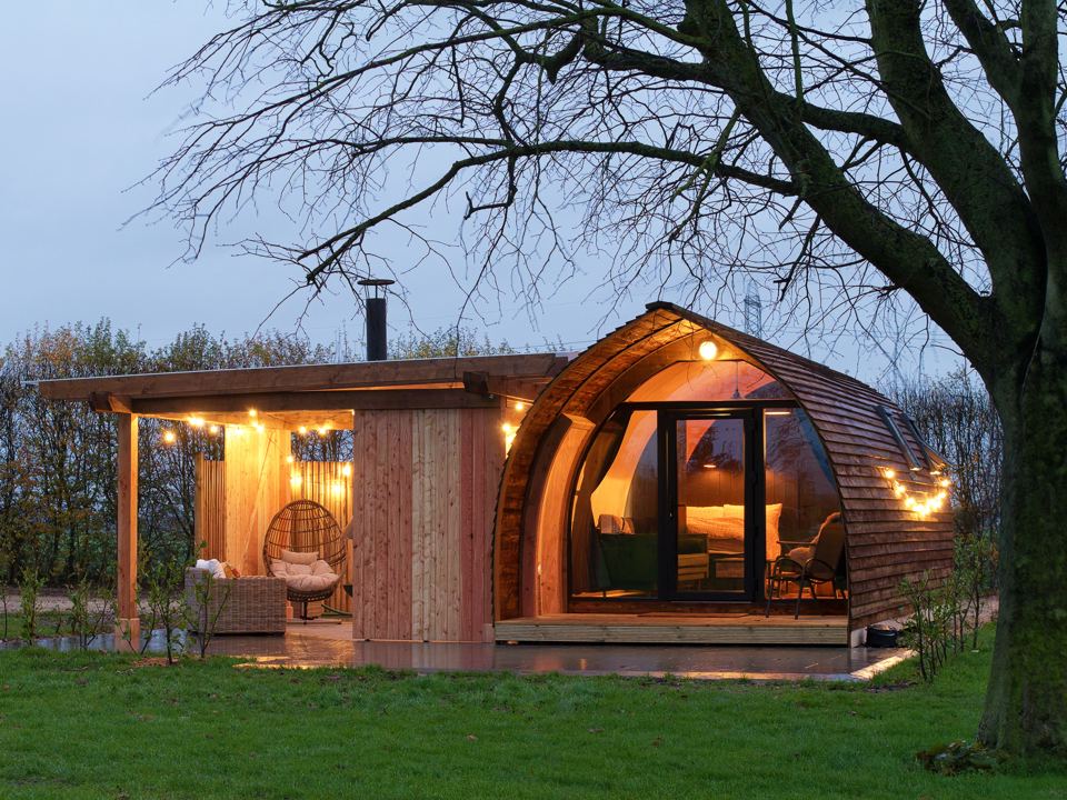 Cabin with covered porch in the evening