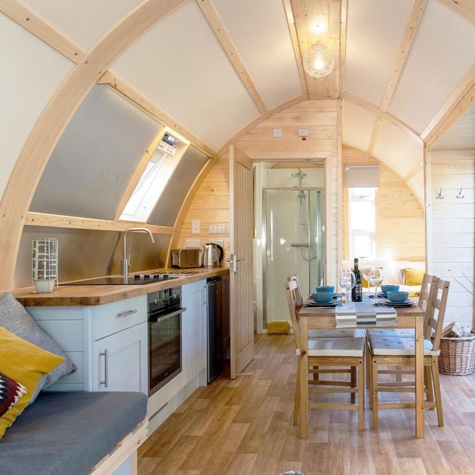 Inside a cabin, kitchen and dining area