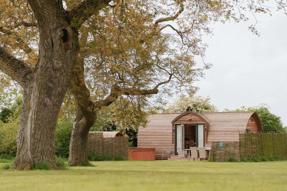 Cabin and hot tub on the grass
