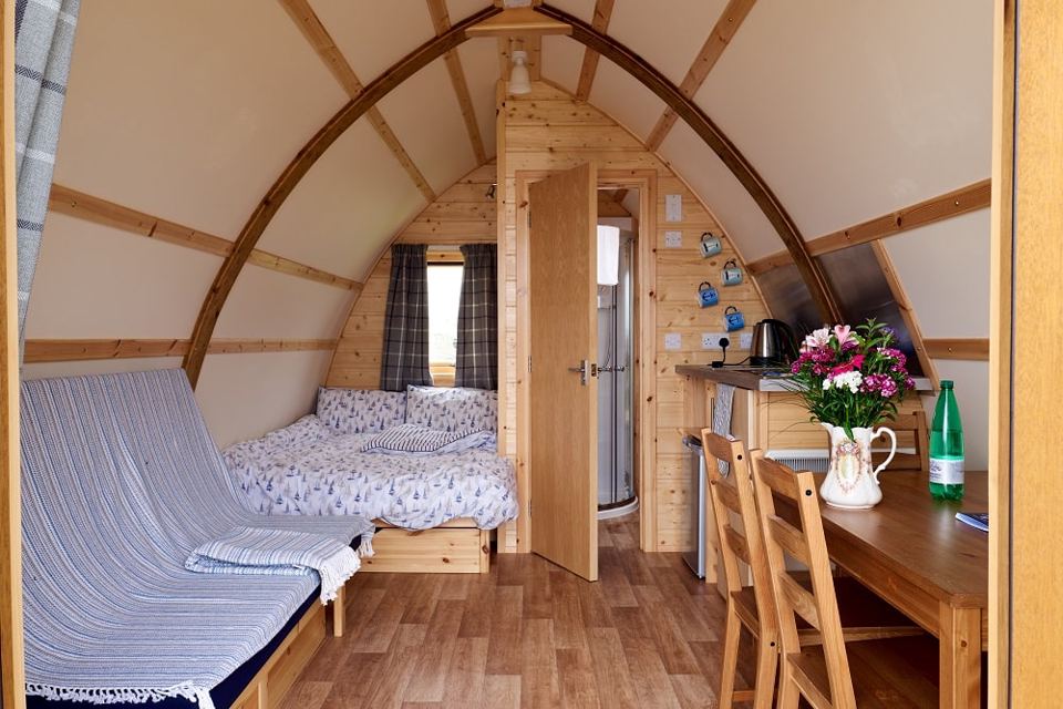 Pod interior with bed and table
