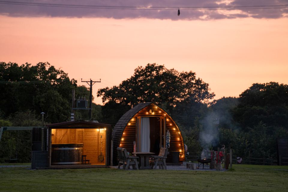 Cabin and hot tub at sunset
