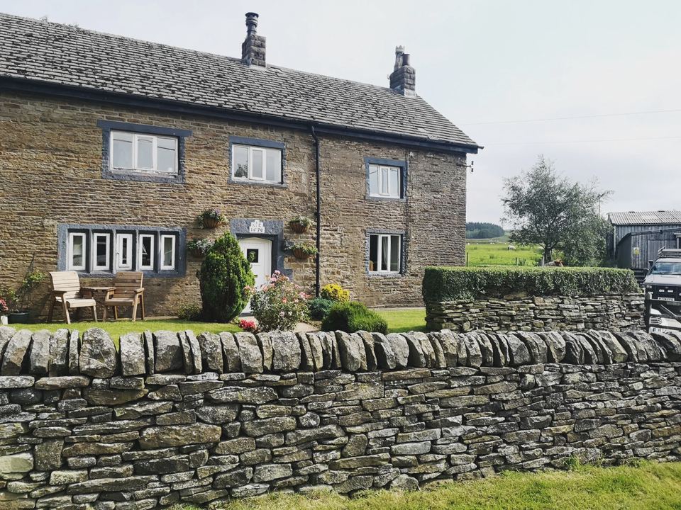 Farmhouse and stone wall