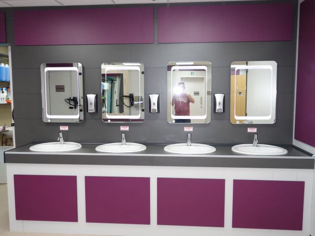 Washbasins with lit mirrors