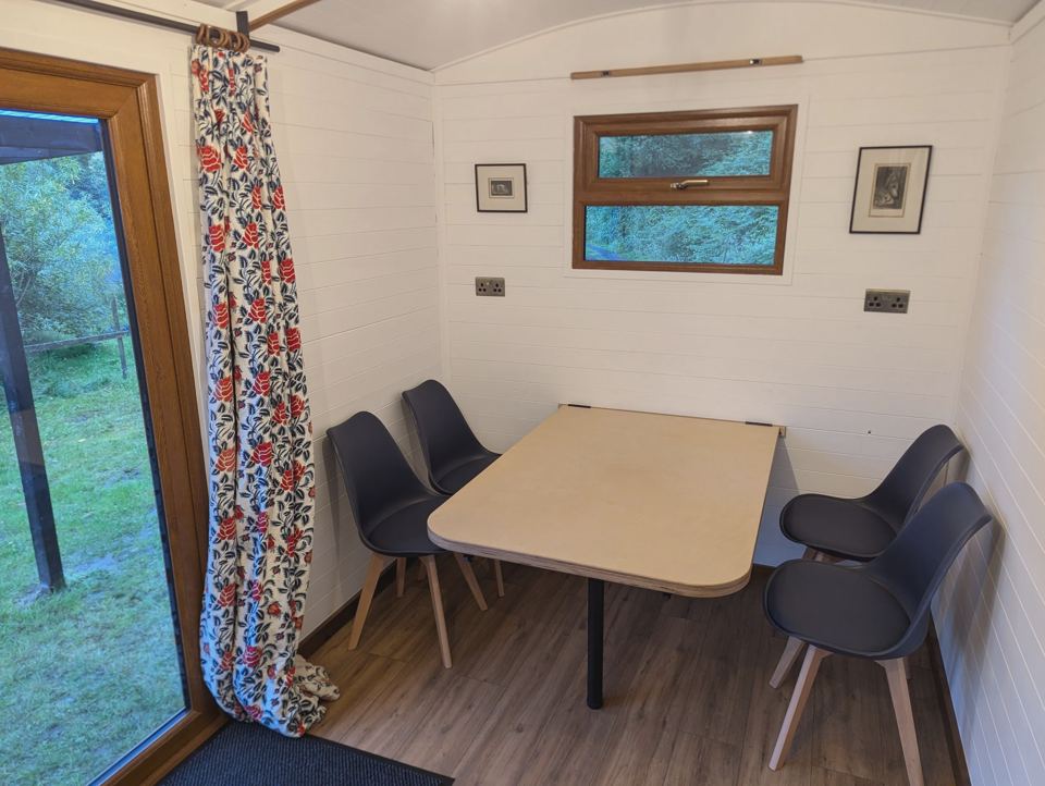 Table and seating inside a hut