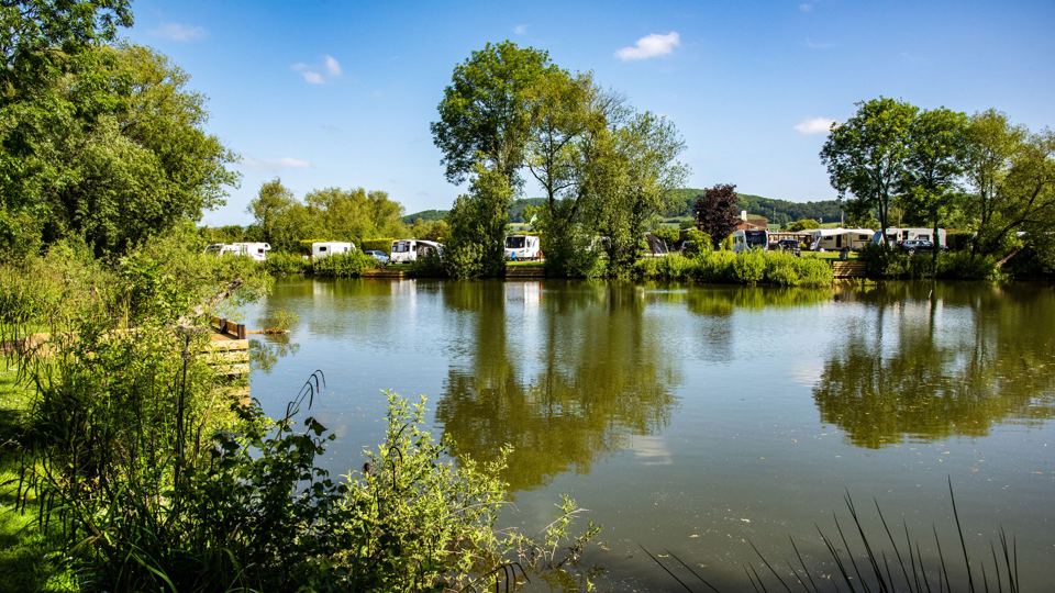 Fishing lake with pitches beyond