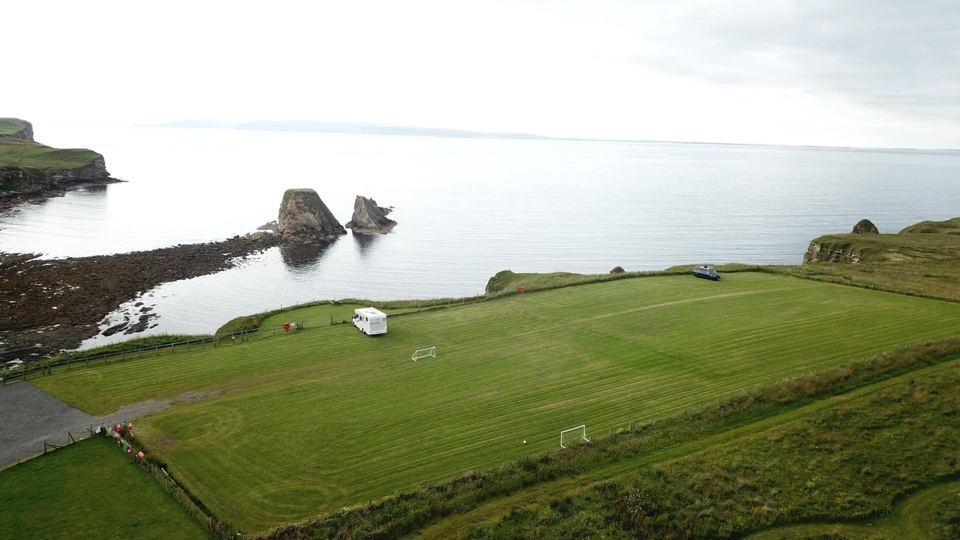 Grass pitch beside the cliff edge
