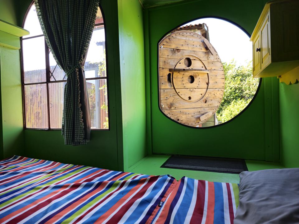 Bed by a round window