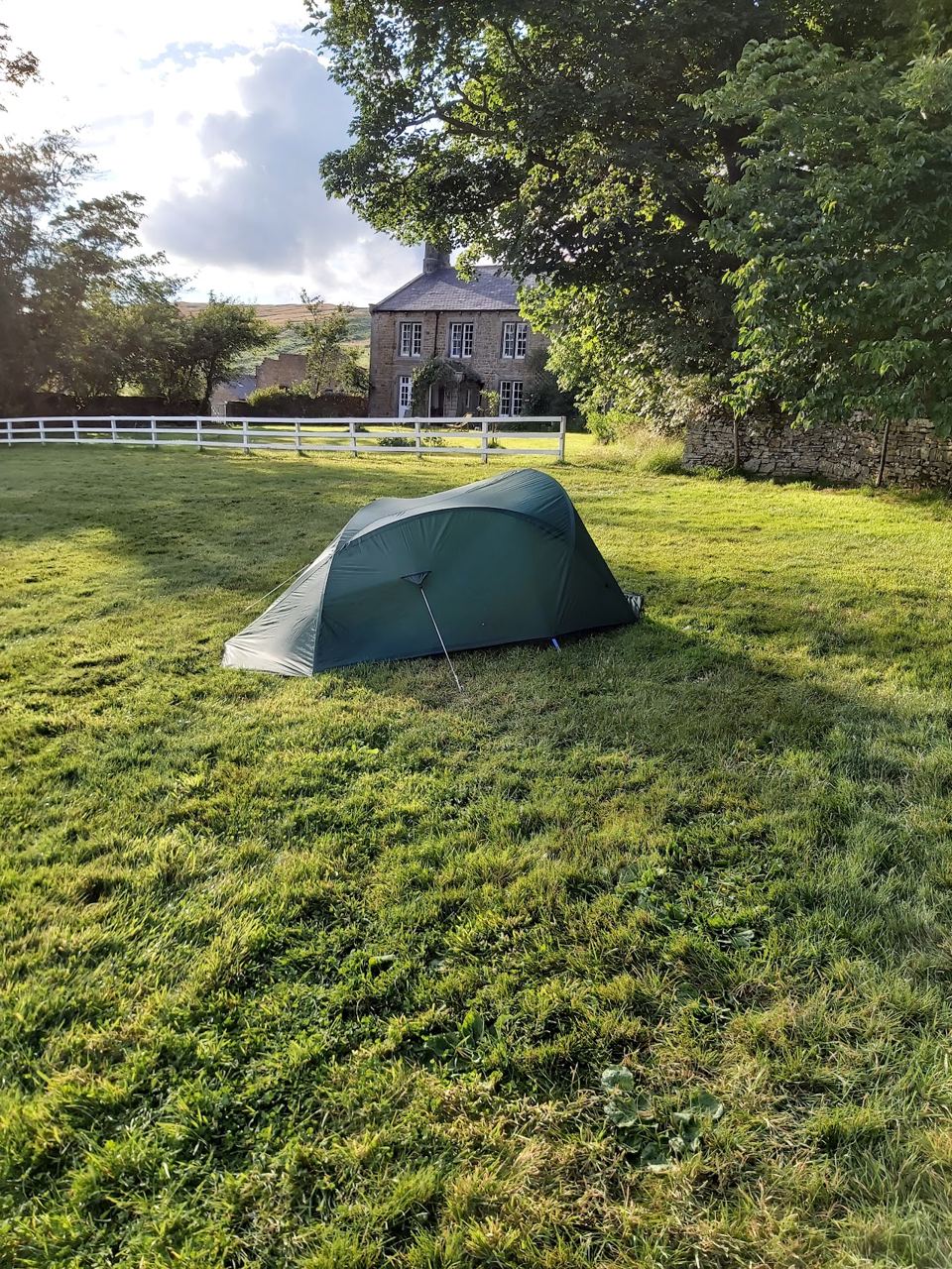 Tent with the farmhouse behind