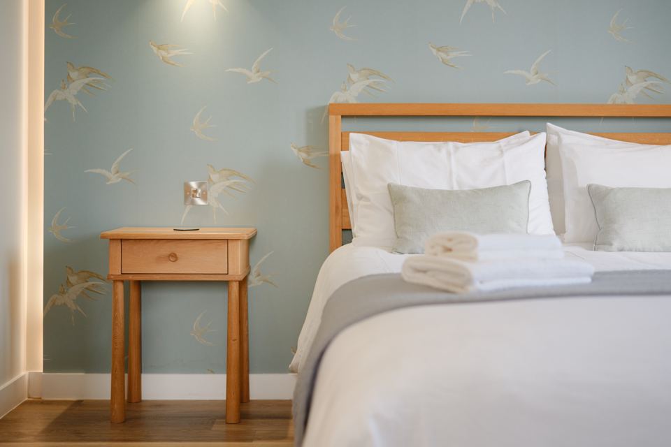 Bedroom with bird wallpaper