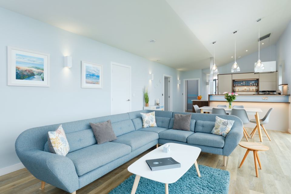 Open-plan lounge with blue sofa