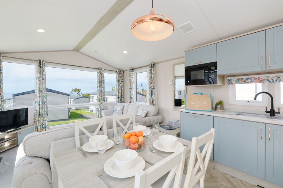 Lounge and kitchen with pale blue units
