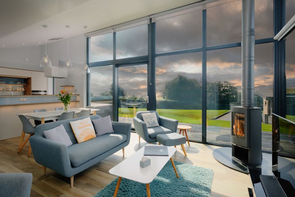 Lounge with log burner and big windows
