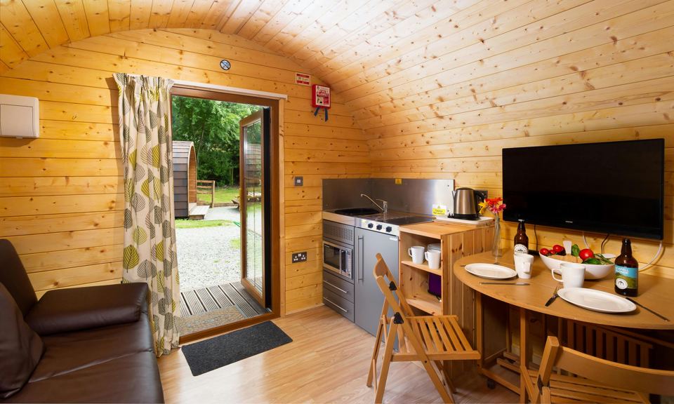 Pod interior with kitchen and TV