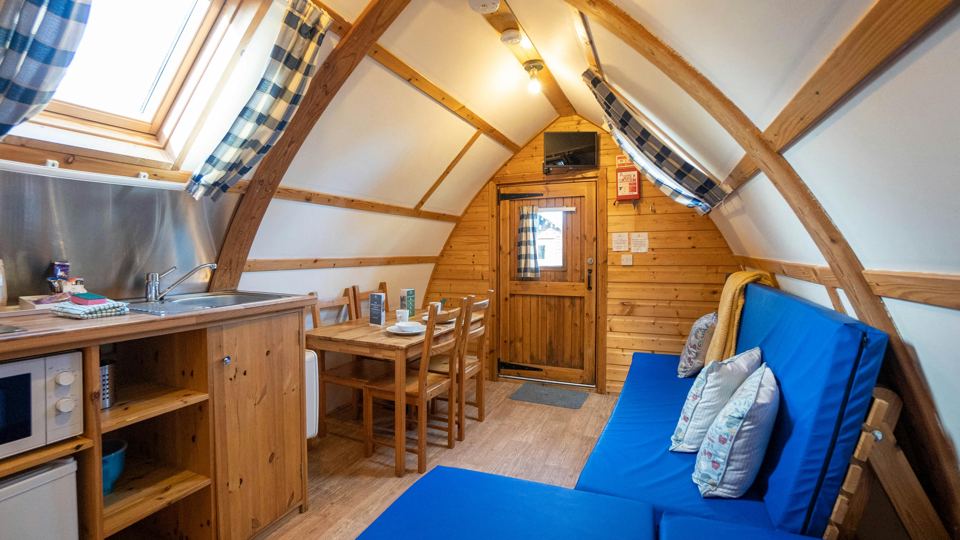 Inside the pod with blue sofa